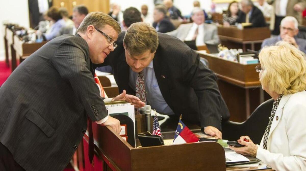 Speaker Tim Moore, left, talks with Reps. Nelson Dollar and Linda Johnson during a 2015 House session. Moore and Senate leader Phil Berger have pushed through bills with little regard for the clarity of the bills’ content or comment from the public.
