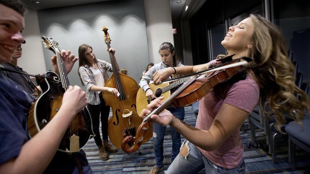 
From left, Jonah Horton, 14, from Wilkesboro, Isaac Ferrell, 17, from South Carolina, Helen Foley, 17, from California, and sisters Frannie, 17, and Cara DiGiovanni, 16, from Tennessee, rehearse in an empty room on the lower level of the Raleigh Convention Center on Thursday. They were selected to represent their Kids On Bluegrass group and perform for about 1.5 hours at the IBMA Awards Show Party at The Memorial Auditorium across the street. Gathered from across the country, the five quickly practiced their harmonies and techniques together before getting dressed for the show. The IBMA will go on this week, but all performances will be indoors due to the rainy weather.
