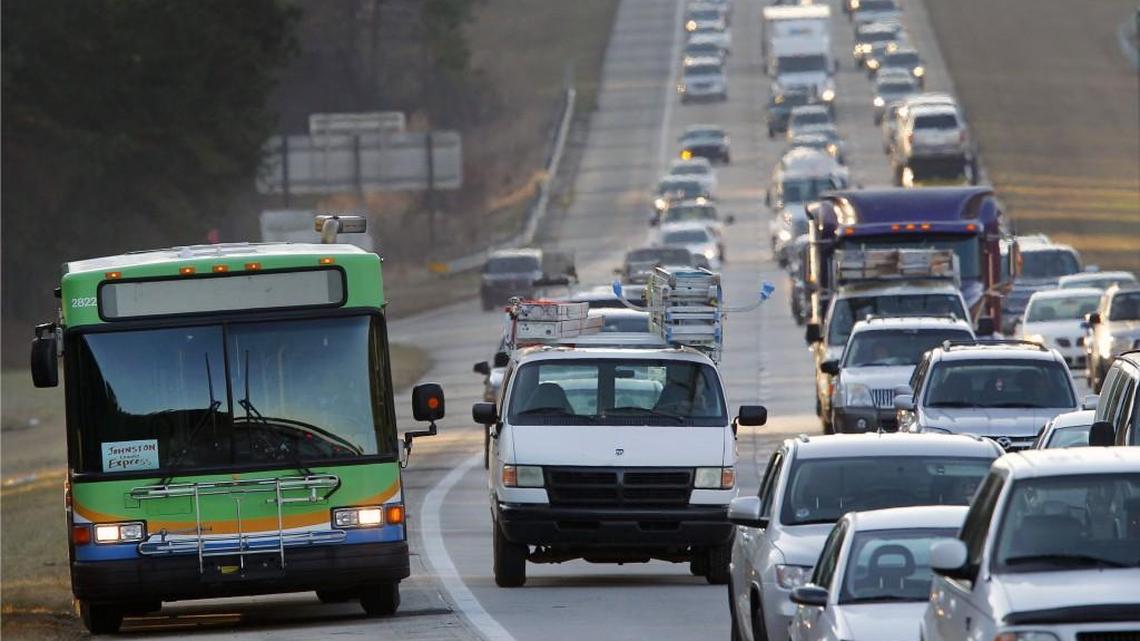 A TTA bus drives up the shoulder as traffic slows to a crawl on I-40 inbound from Johnston Co. and southern Wake Co. a rush hour. A proposal for more express buses and a commuter train could provide more transit choices as Wake’s population grows.