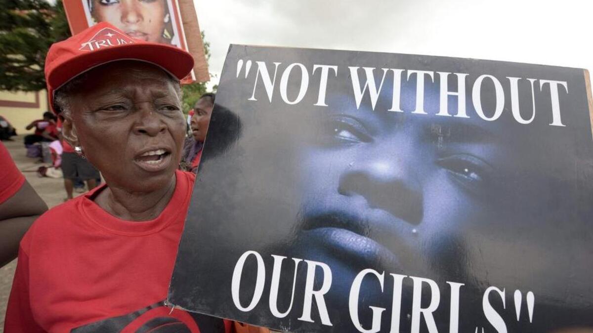 A member of “Bring Back Our Girls” movement carries placard to press for the release of the missing Chibok schoolgirls in Lagos, on April 14, 2016. Nigeria’s government said it was studying a “proof of life” video showing 15 of the more than 200 schoolgirls abducted by Boko Haram, as parents and their supporters marked the second anniversary of the kidnapping. A total of 276 girls were abducted from the Government Girls Secondary School in Chibok, northeast Nigeria, on April 14, 2014. Fifty-seven escaped in the immediate aftermath.