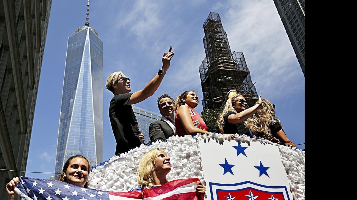 The U.S. women's soccer team, including Abby Wambach, top left, celebrates in New York.