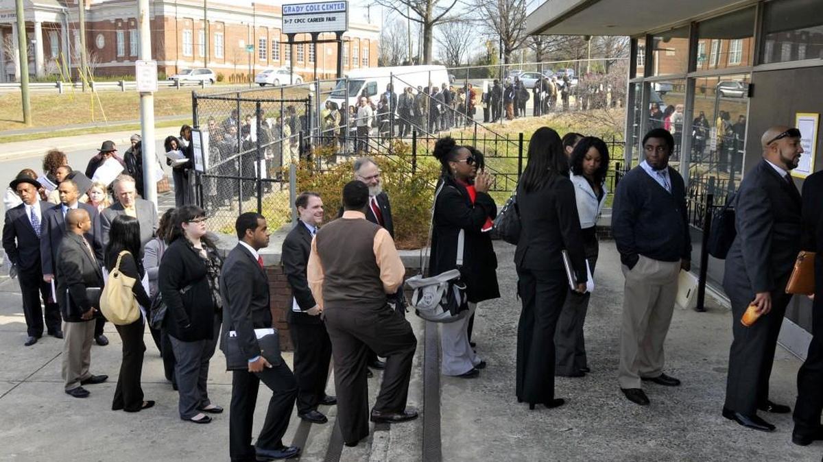 A long line of job seekers in front of the Grady Cole Center before the start of the CPCC Career Fair at the Grady Cole Center in 2013.