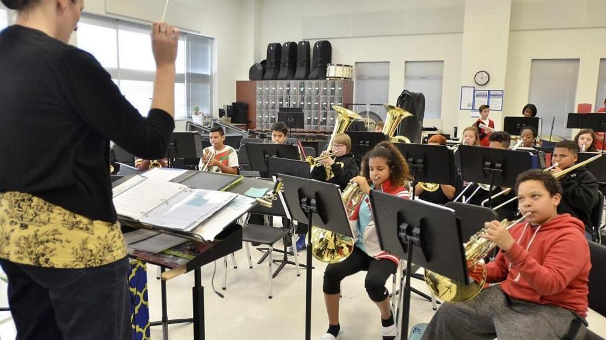 Wendell Middle School band teacher Cat Slade directs one of her music classes at the school in Wendell on Nov. 16, 2016. Some schools are cutting back on music and PE classes to meet a state requirement for smaller class sizes.