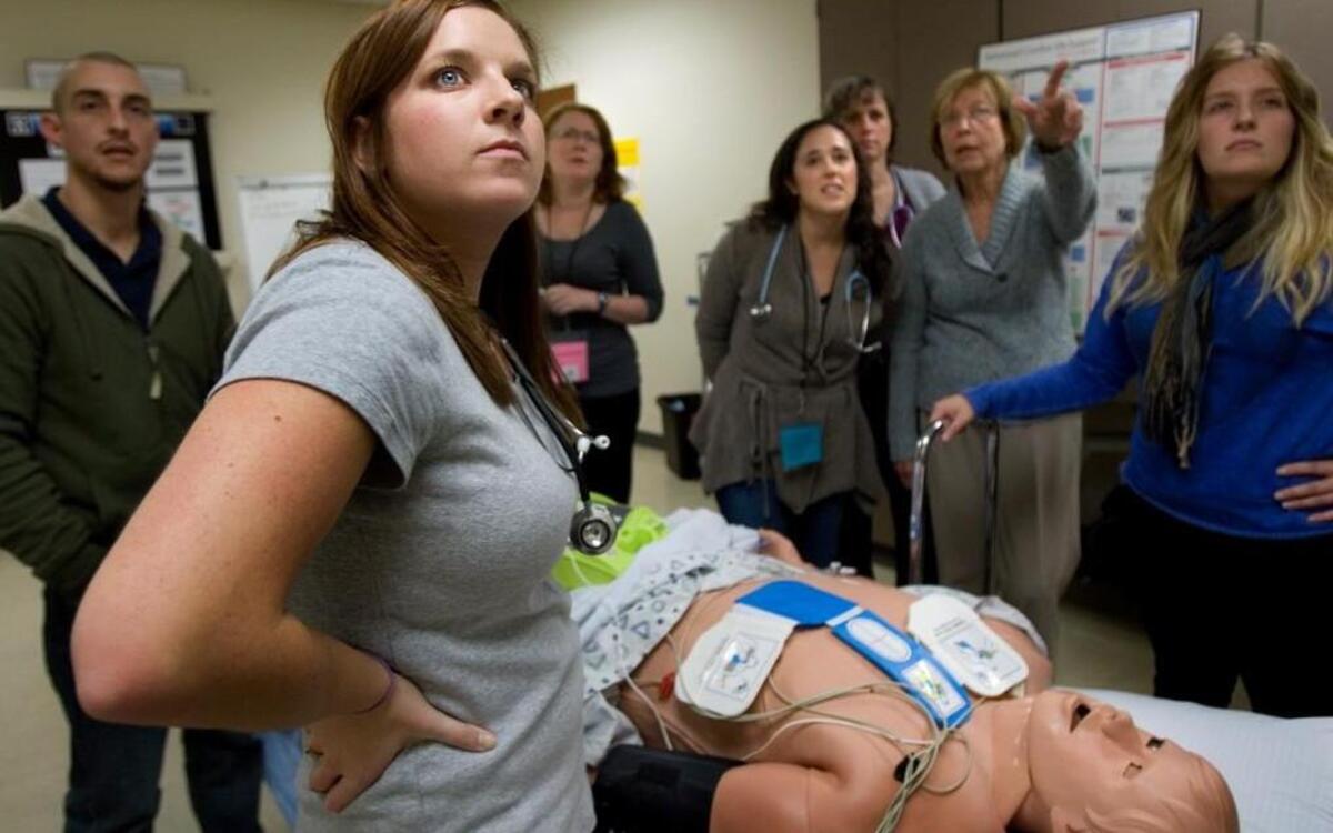 UNC nursing school students get hands-on experience with a human patient simulator.