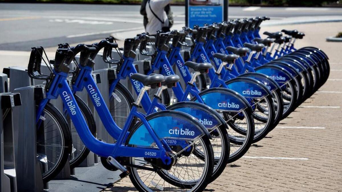 Bicycles that are part of the NYC Bike Share program are lined up at a dock and lock station at the Brooklyn Navy Yards in New York.