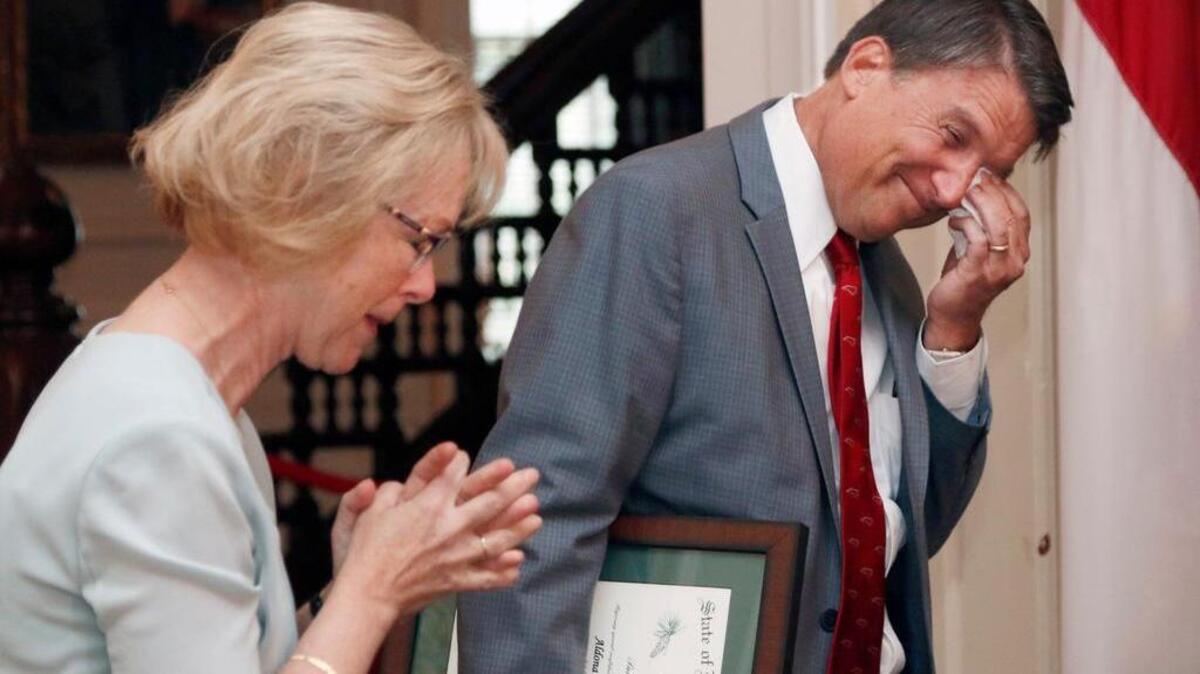 
From left, outgoing NC DHHS Secretary Aldona Wos gets emotional as NC Governor Pat McCrory wipes away a tear before awarding Wos The Order of the Long Leaf Pine during a press conference Wednesday, August 5, 2015 at the Governor's Mansion in Raleigh, NC. McCrory announced Wos' resignation at the emotional ceremony. 
