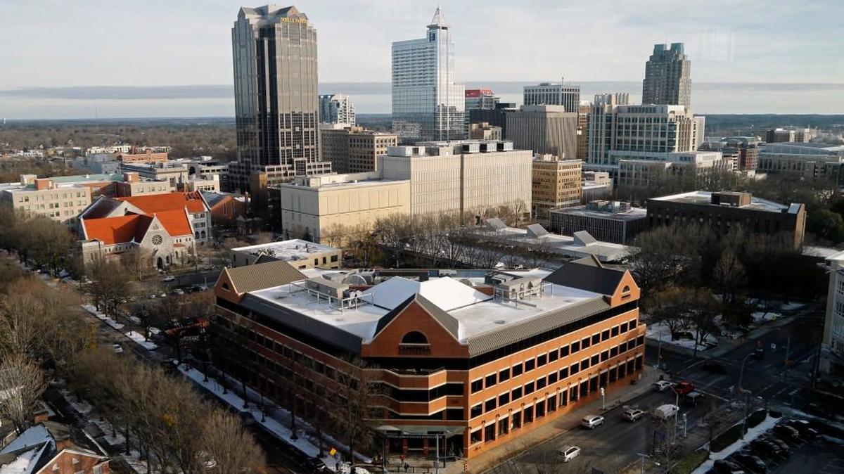 The Raleigh skyline is seen from the restaurant on the 20th floor of the Holiday Inn on Jan. 10, 2017. The Campbell University Law School is the brick building in the foreground.