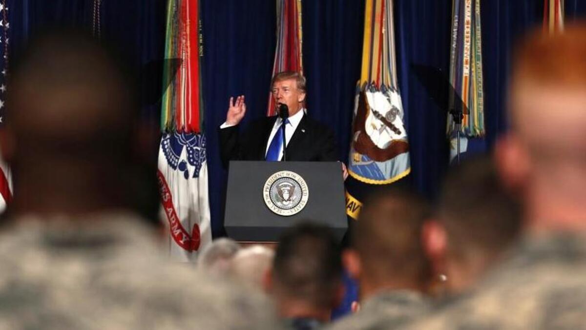 FILE - In this Aug. 21, 2017, file photo, President Donald Trump speaks at Fort Myer in Arlington Va., about U.S. strategy in Afghanistan. Trump on Oct. 17 will call the families of four soldiers killed this month in Niger, the White House says, as Trump again casts doubt on whether his predecessor appropriately consoled the families of military personnel who died in war.