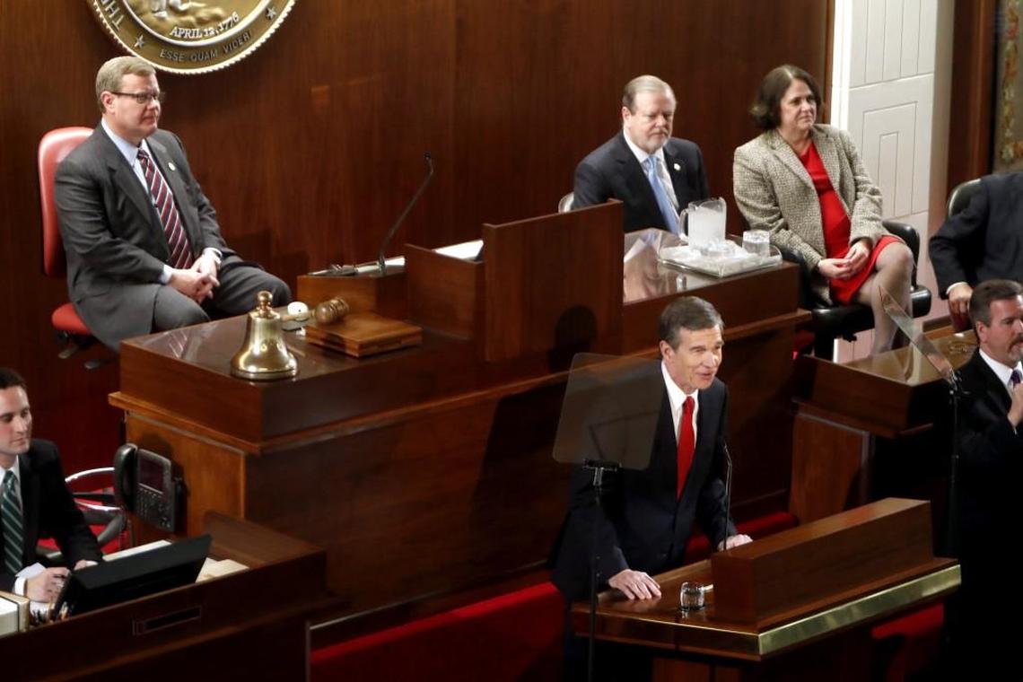 In this 2017 file photo, Gov. Roy Cooper, front right, delivers his first State of the State address to a joint session of the state legislature in the House chamber of the Legislative Building in Raleigh. Behind him is House Speaker Tim Moore, left, Senate President Pro Tem Phil Berger.