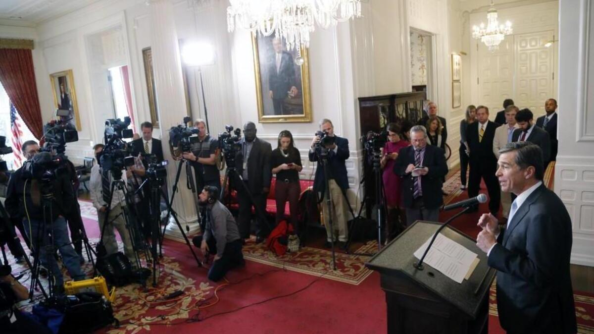 Gov. Roy Cooper holds a press conference at the Executive Mansion in Raleigh on March 30 to announce that he signed HB 142, a compromise replacement bill for controversial HB2, that the General Assembly passed earlier in the day.