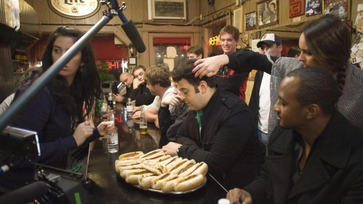 
The Travel Channel’s Adam Richman has his hair touched up by a makeup artist prior to recording a segment for his show Man v. Food at the historic Roast Grill in downtown Raleigh.
