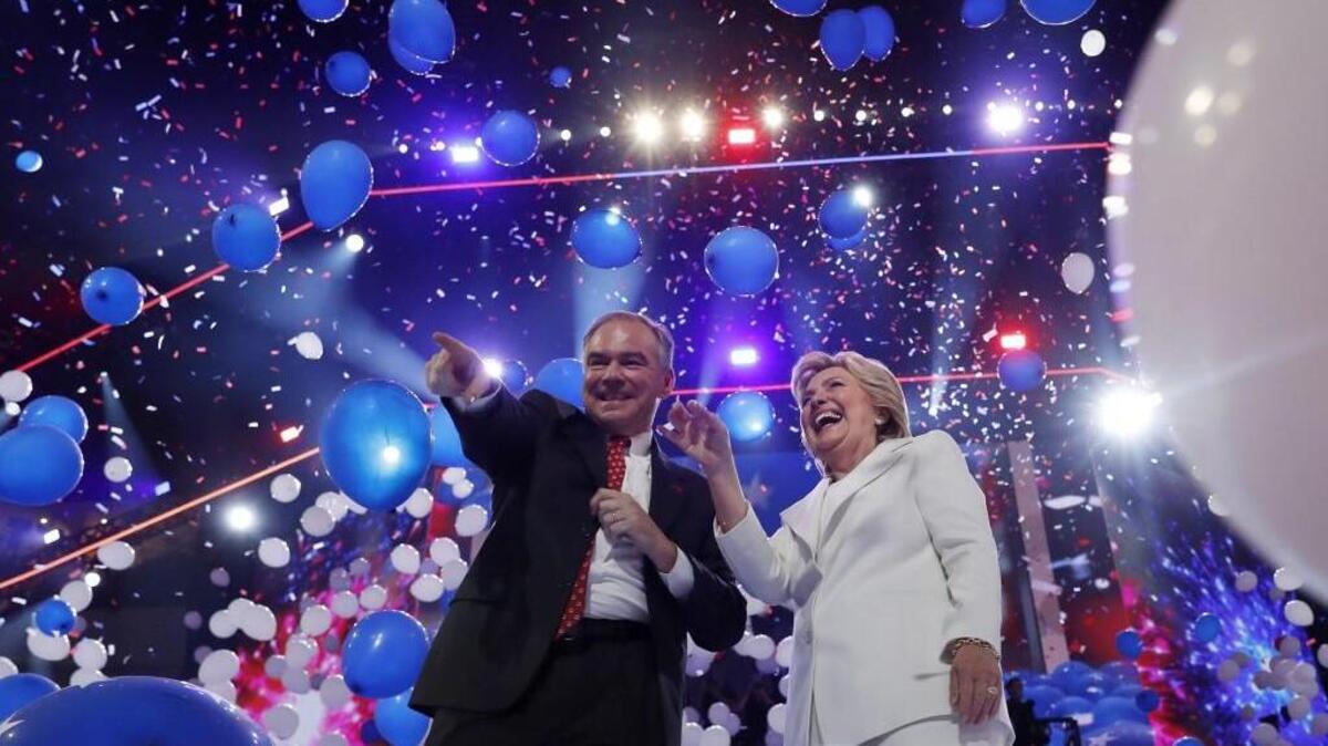 Balloons fall as Democratic presidential nominee Hillary Clinton is joined by Democratic vice presidential candidate, Sen. Tim Kaine, D-Va., for a celebration on stage after addressing the delegates during the final day of the Democratic National Convention in Philadelphia. (AP Photo/Carolyn Kaster)