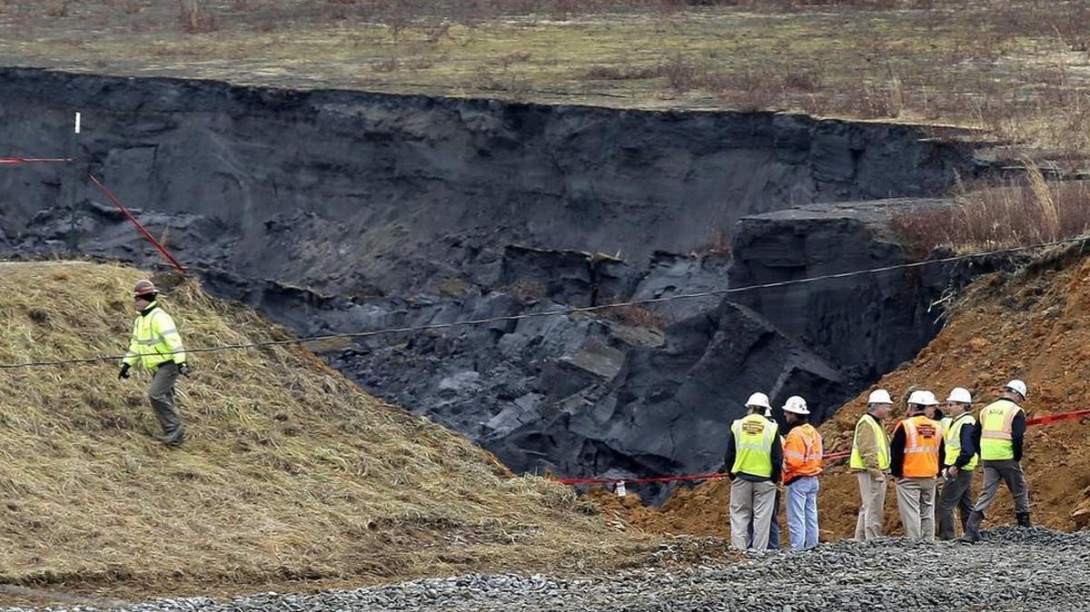 
Duke Energy engineers and contractors survey the site of a February 2014 coal ash spill at the Dan River power plant in Eden.
