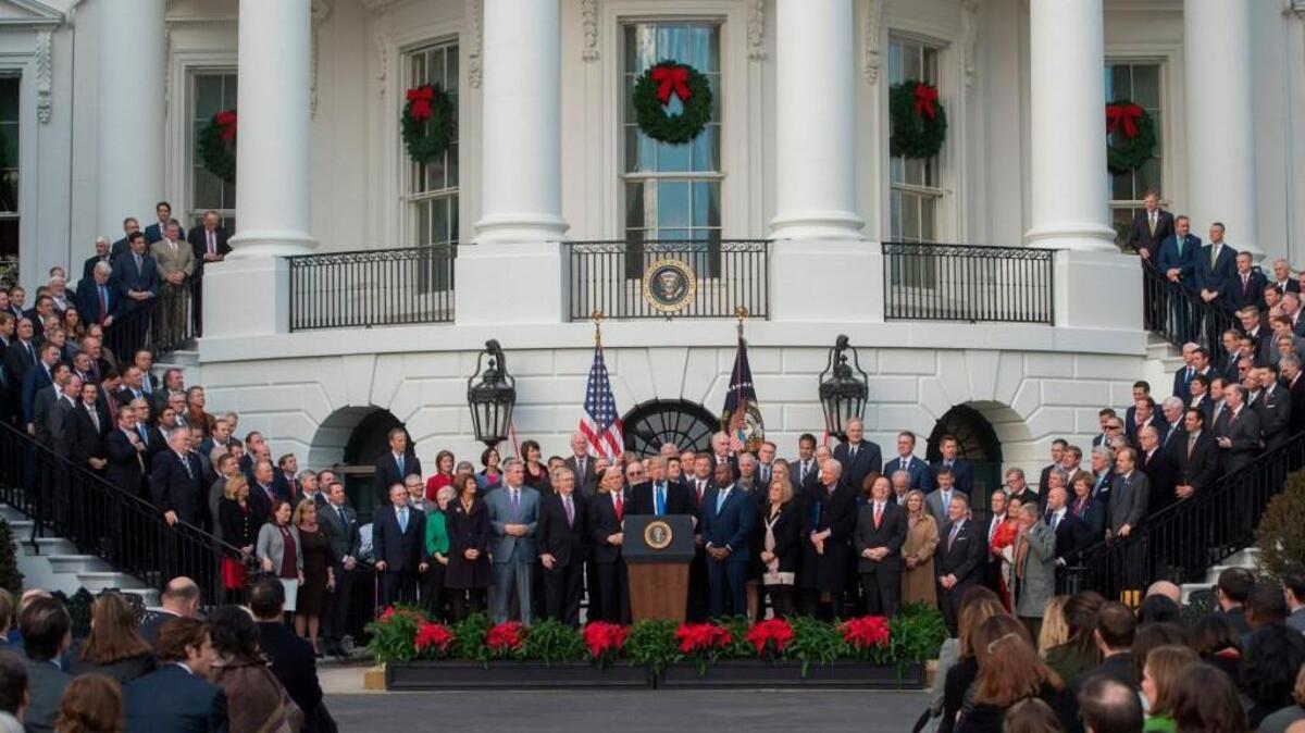 US President Donald Trump speaks about the passage of tax reform legislation on the South Lawn of the White House in Washington, DC, December 20, 2017. Trump hailed a "historic" victory Wednesday as the US Congress passed a massive Republican tax cut plan, handing the president his first major legislative achievement since taking office nearly a year ago.