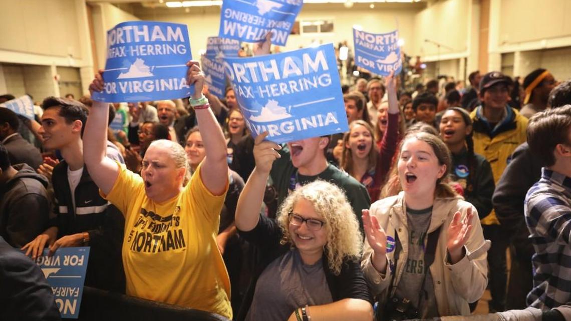 Supporters of Ralph Northam celebrate the Democrat’s victory in the Virginia governor’s race at an election night rally November 7, 2017 in Fairfax, Virginia. Northam fought a close race with Republican candidate Ed Gillespie.