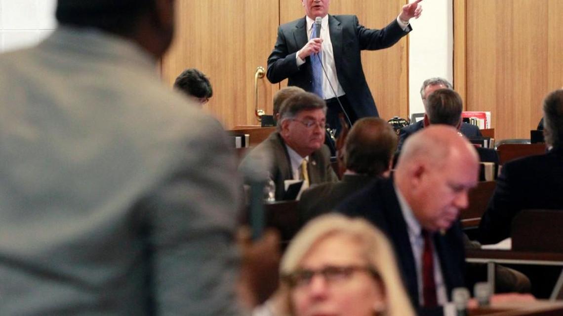 Rep John Blust, right, and Rep. Marcus Brandon argue whether Republicans have a plan to cover the state's roughly 1.5 million uninsured residents as the North Carolina House debates a bill to expand Medicaid coverage to low income residents Tuesday, Feb. 26, 2013. The House voted 74-40 to not expand Medicaid.