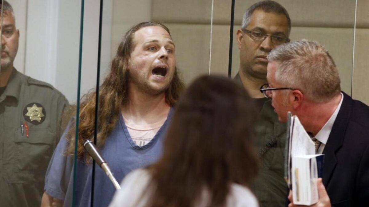 Jeremy Joseph Christian, a white supremacist, shouts as he is arraigned in Multnomah County Circuit Court in Portland, Ore., Tuesday, May 30, 2017. Authorities say Christian started verbally abusing two young women, including one wearing a hijab. When three men on the train intervened, police say, Christian attacked them, killing two and wounding one.
