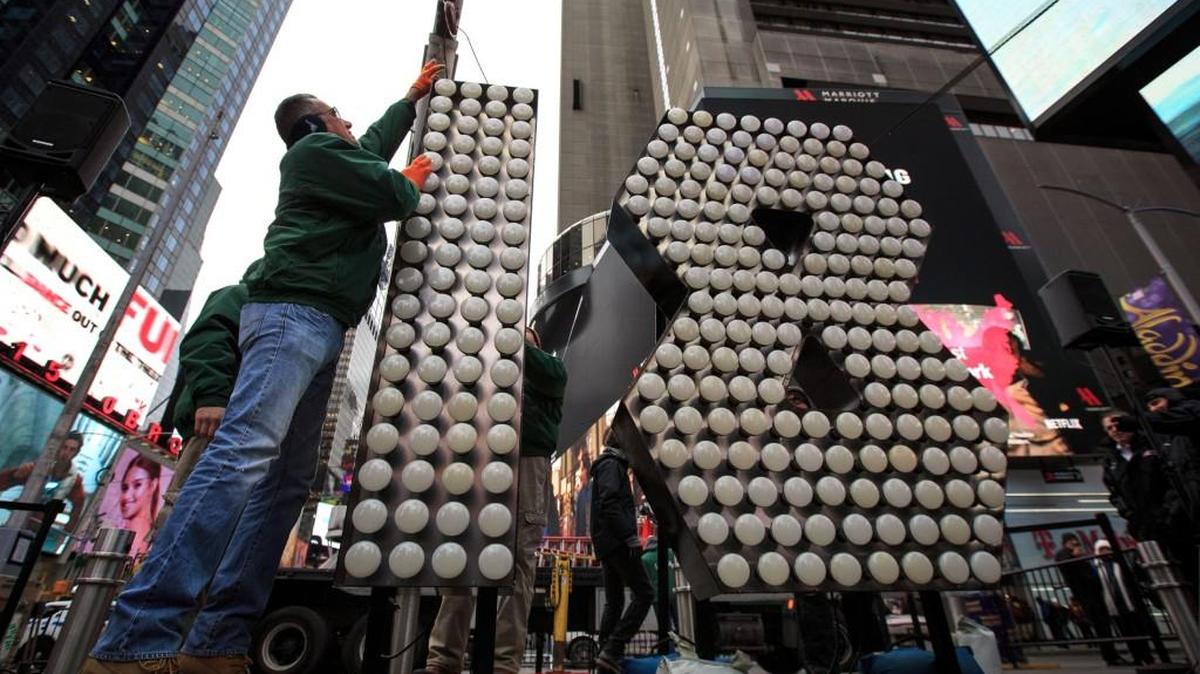 Workers unload the numerals 1 and 8 as they arrive in Times Square ahead of the New Year's Eve celebration, arrive in Times Square, December 13, 2017 in New York City.