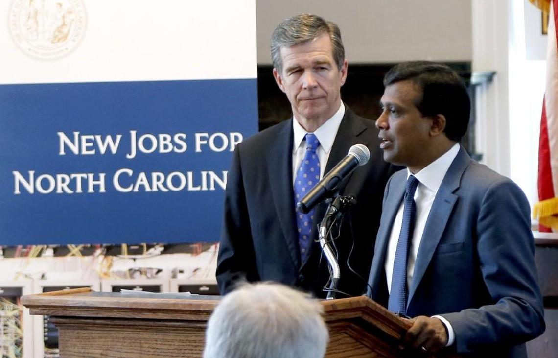 Gov. Roy Cooper, left, and Infosys president Ravi Kumar announce that the tech company plans to open a facility in the Triangle. It is expected to create 2000 jobs over the next five years. The announcement was made in the old House Chambers in the N.C. Capitol Building on July 6, 2017. The company will be eligible for more than $22 million in tax breaks from North Carolina if it follows through on building a technology hub and hiring workers in the state.
