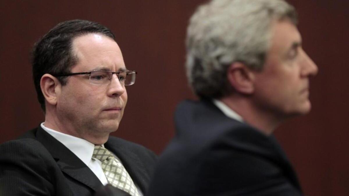 Dana Cope, former executive director of the State Employees Association of North Carolina, with his lawyer Roger Smith, Jr., right, listens to courtroom proceedings where he pled guilty of stealing money from SEANC in front of Wake County Superior Court Judge Donald Stephens on Tuesday, November 17, 2015. Judge Stephens sentenced Cope to 58 to 82 months in state prison.