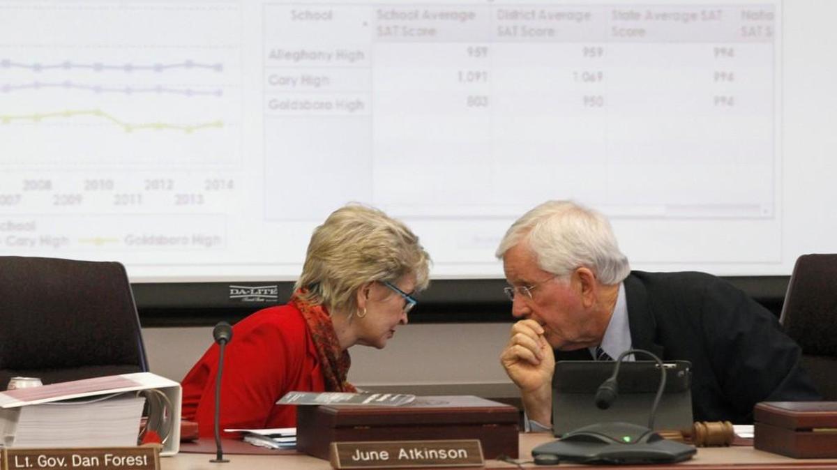 State Board Chairman Bill Cobey, right, and State Superintendent June Atkinson talk during a meeting of the North Carolina State Board of Education meeting in February.