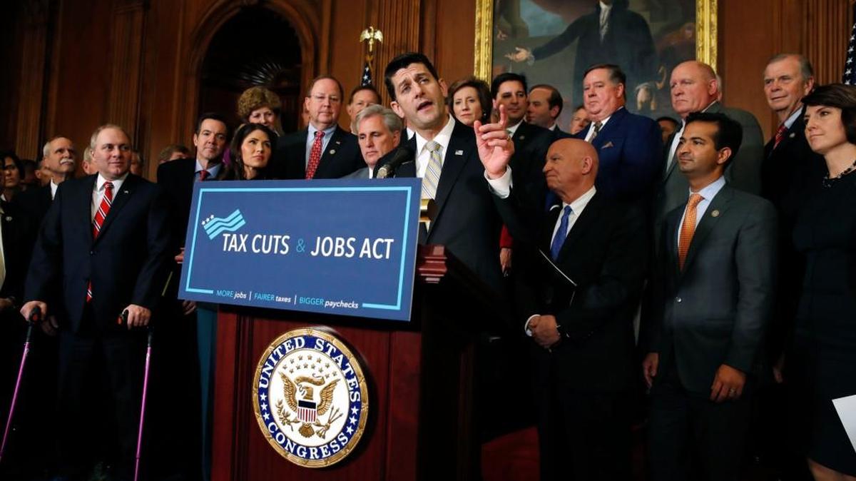 House Speaker Paul Ryan of Wis., joined by House Republicans, speaks following a vote on tax reform in November.