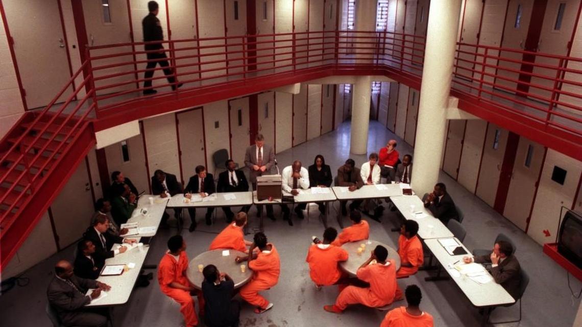 A sheriff’s deputy makes the rounds of cells at the Wake County Detention Center. News & Observer file photo.