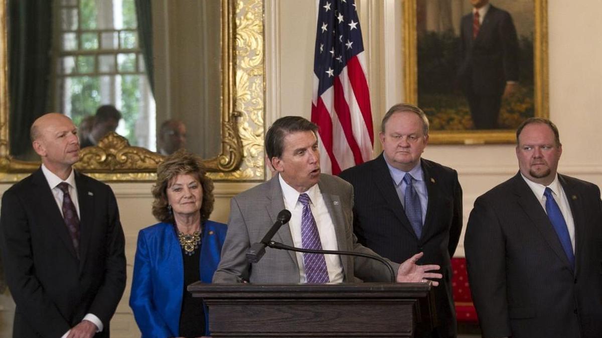 North Carolina Governor Pat McCrory touts the new Medicaid privatization legislation before signing it into law during a ceremony at the Executive Mansion. The state has asked the federal government to approve the proposed Medicaid changes.
