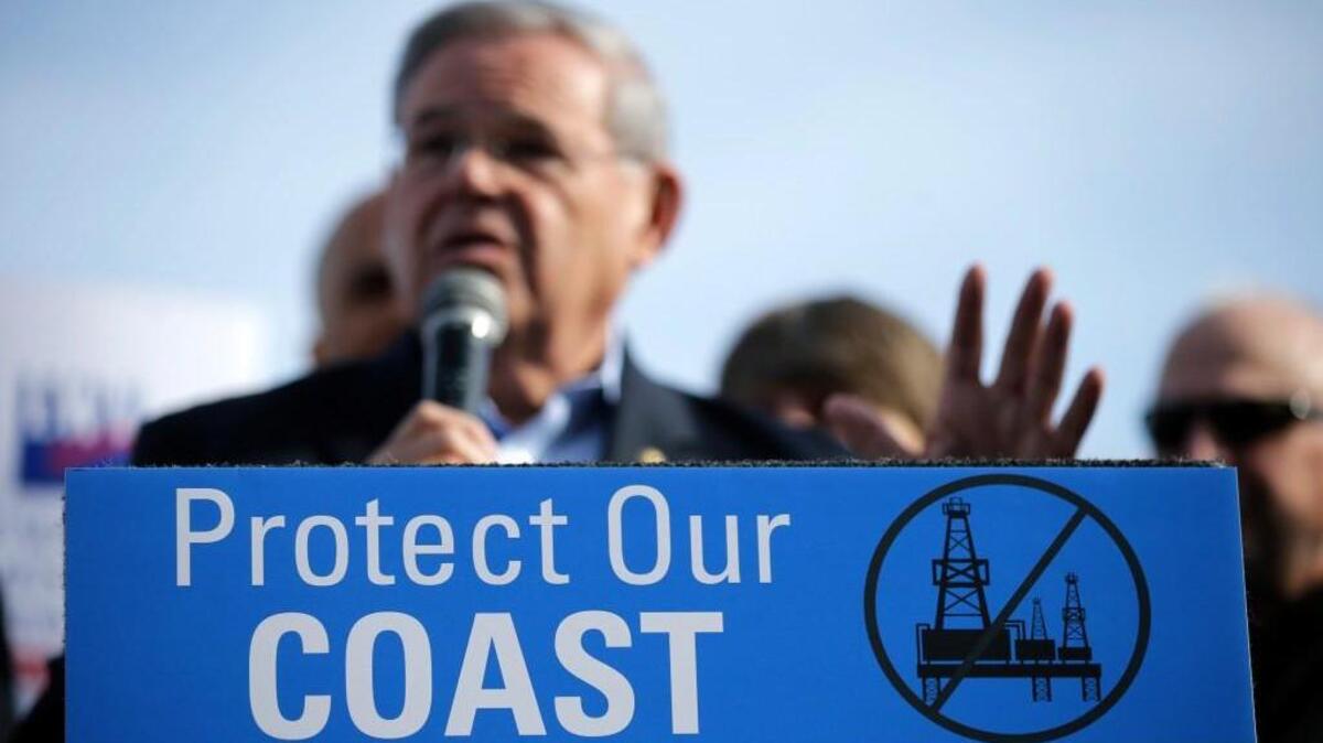FILE - In this Jan. 31, 2016 file photo, Democratic U.S. Sen. Bob Menendez addresses a large rally in Asbury Park, N.J., opposing federal plans that would allow oil and gas drilling in the Atlantic Ocean. President-elect Trump has said that he intends to open up offshore drilling, and environmentalists and coastal businesses say it could be the first major fault line that divides them from the new president.
