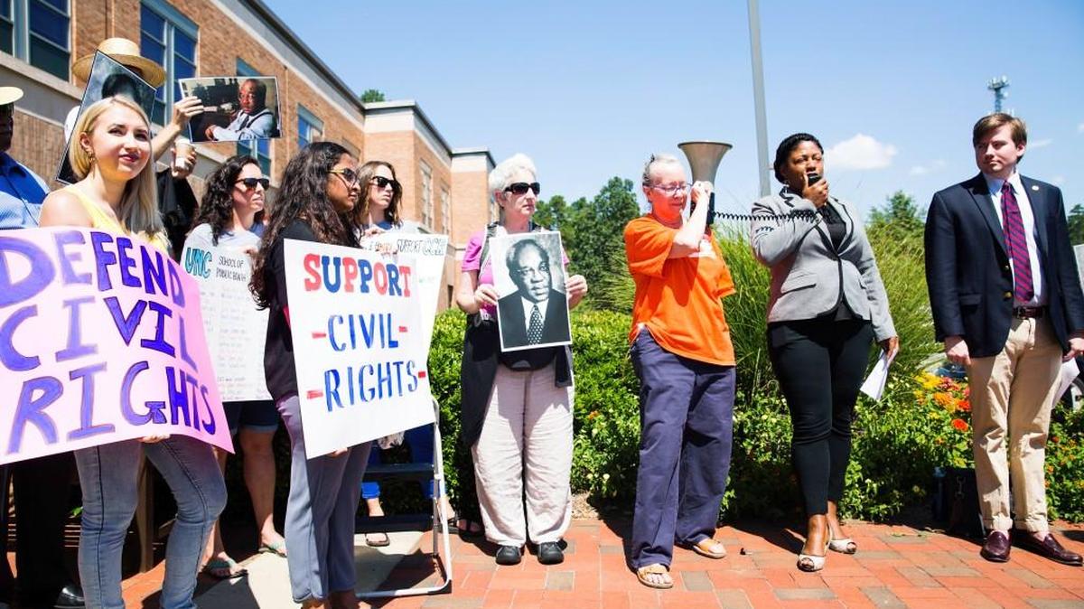 Protestors stand outside The Center for Leadership Development in support of the UNC Civil Rights Center before a committee debate determining the center's future on Aug. 1, 2017, in Chapel Hill, NC.