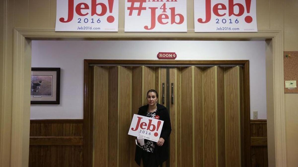 Campaign staff person Camlin Moore gets ready for a campaign event of Republican presidential candidate Jeb Bush at Shealy’s Bar-B-Que in Leesville, South Carolina.