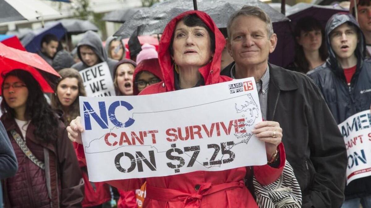 Linda Burton of Raleigh demonstrates with hundreds in support of a higher minimum wage during an April 15 rally at Shaw University in Raleigh.