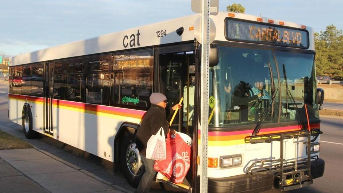 Judith Linder boards a Route 1 Capital Area Transit bus in front of Tarrymore Square shopping center on Capital Boulevard in Raleigh. Wake County’s proposed transit plan would greatly expand bus service and add a commuter rail line.