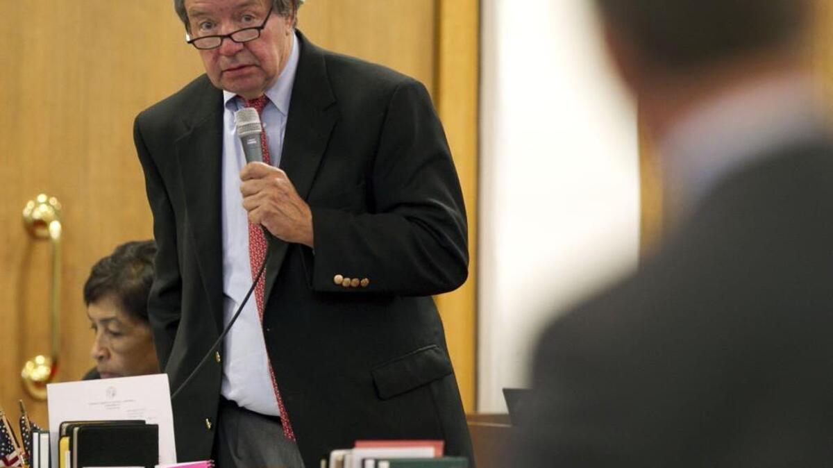 Rep. Paul Luebke (left) of Durham, N.C. and Rep. Mike Hager of Burke County debate SB 729, legislation dealing with coal ash reform during a 2014 House session. Luebke, who served 25 years in the House, died Saturday as a result of lymphoma.