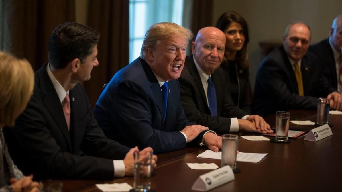 President Donald Trump, flanked by Speaker of the House Rep. Paul Ryan (R-Wis.), left, and House of Representatives Ways and Means Committee Chairman, Rep. Kevin Brady (R-Texas), speaks with reporters about his proposed tax reform plan in the cabinet room during a meeting with congressional GOP leaders at the White House in Washington, D.C., on November 2, 2017.