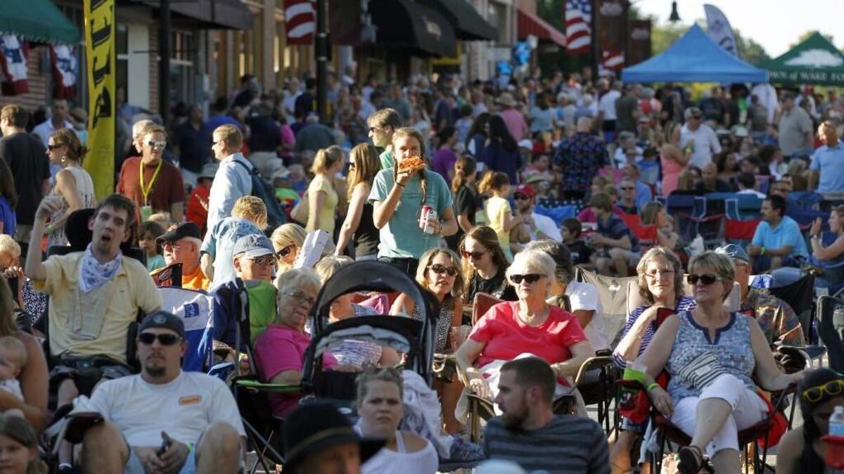 Thousands gather to eat, drink, play, dance and socialize as the town of Wake Forest holds Friday Night on White, an outdoor concert series, on Friday, June 10, along South White Street in downtown Wake Forest. The monthly event runs through September. Many towns around the Triangle are trying to become more than bedroom communities and provide something for residents in their own community.
