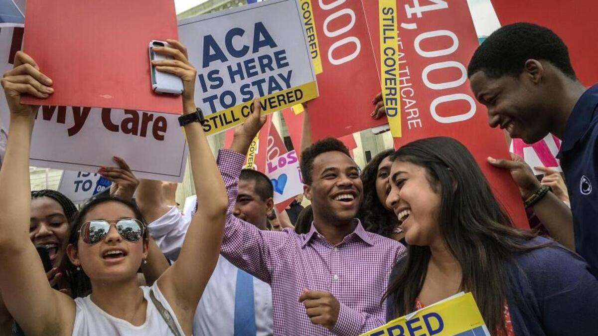 Students from around the country celebrate in front of the Supreme Court in Washington after the justices upheld a key provision of the Affordable Care Act in 2015. A $3.4 million federal grant will help people in North Carolina find insurance through the ACA.