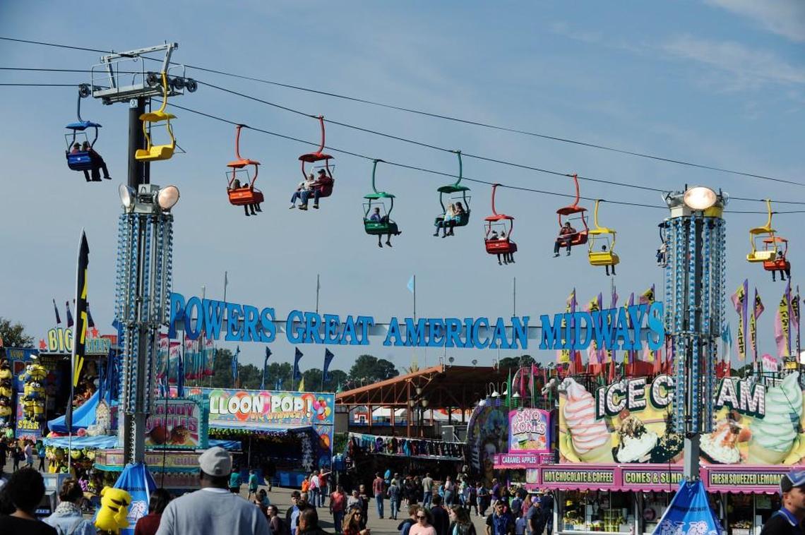Passengers ride the State Fair Flyer above the fair's midway in Raleigh, N.C. on Saturday, October 15, 2016.