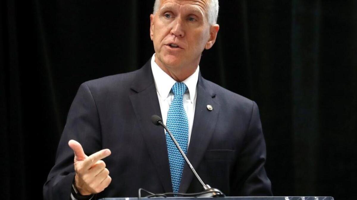 U.S. Senator Thom Tillis speaks to a group at the Sheraton in downtown Raleigh on May 12, 2017. A couple dozen anti-Trump protestors were outside while he spoke..