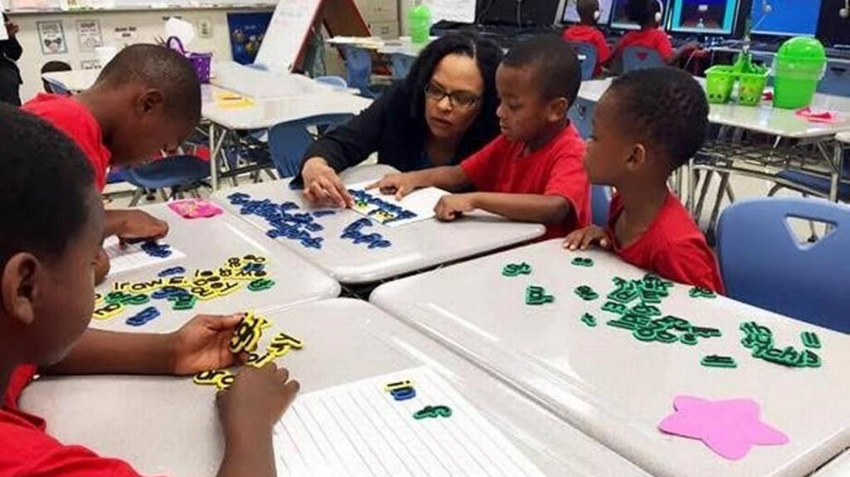 Achievement District Superintendent Malika Anderson with Tennessee students. Courtesy of Tenn. Achievement School District