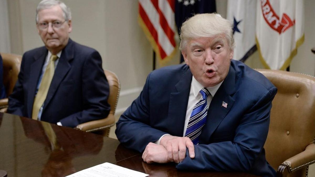 President Donald Trump speaks as Senate Majority Leader Mitch McConnell looks on during a meeting with House and Senate leadership on June 6, 2017 in the Roosevelt Room of the White House in Washington, D.C.