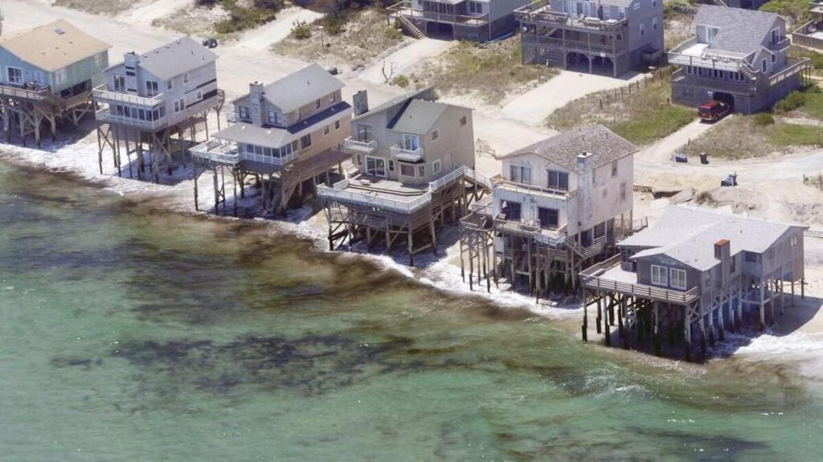 Homes in Nags Head are perilously close to the Atlantic Ocean. As climate change leads to rising sea levels, North Carolina must adjust its coastal development policies. PHOTO BY JOHN D. SIMMONS - jsimmons@charlotteobserver.com