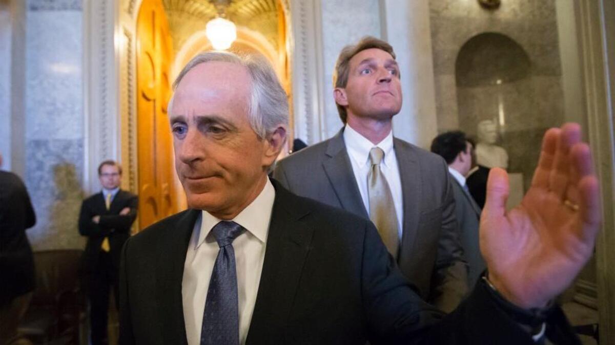 In this file photo from Thursday, Feb. 28, 2013, Sen. Bob Corker, R-Tenn., left, and Sen. Jeff Flake, R-Ariz., right, leave the chamber after votes on federal spending reductions, at the Capitol in Washington. President Donald Trump is lashing out at the two Republican senators who have recently seared him with criticism.
