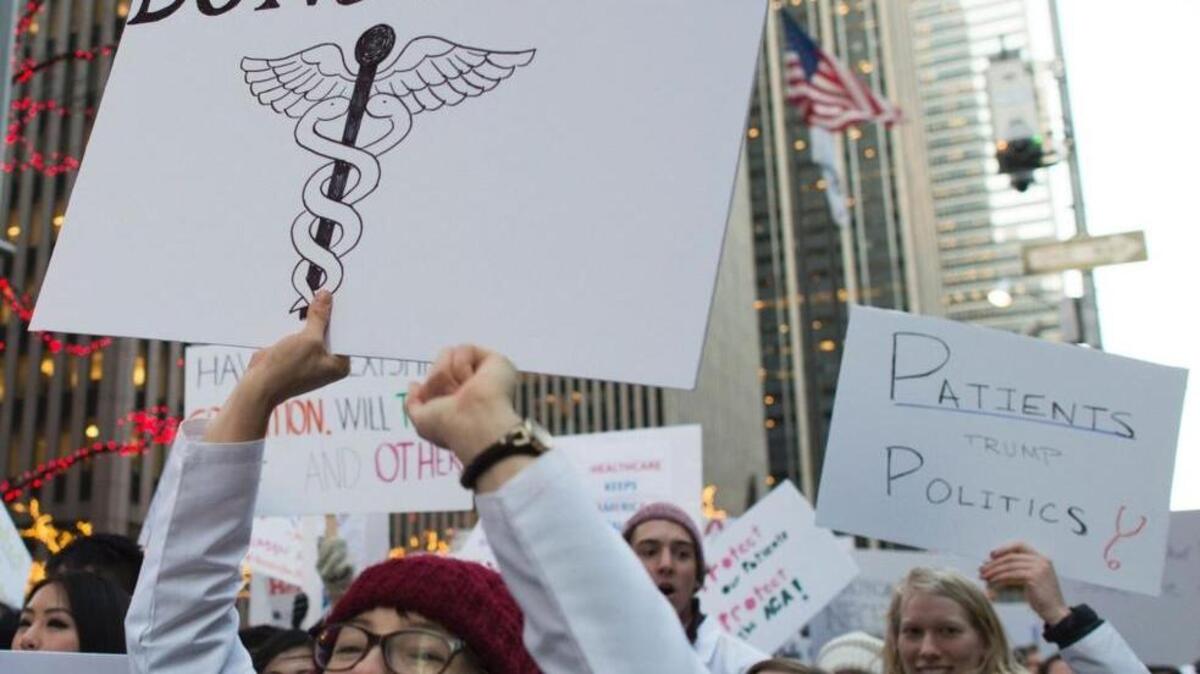 Medical students, deans, and faculty from New York City protest the consequences of repealing the ACA Jan. 30 outside the News Corp headquarters in New York.