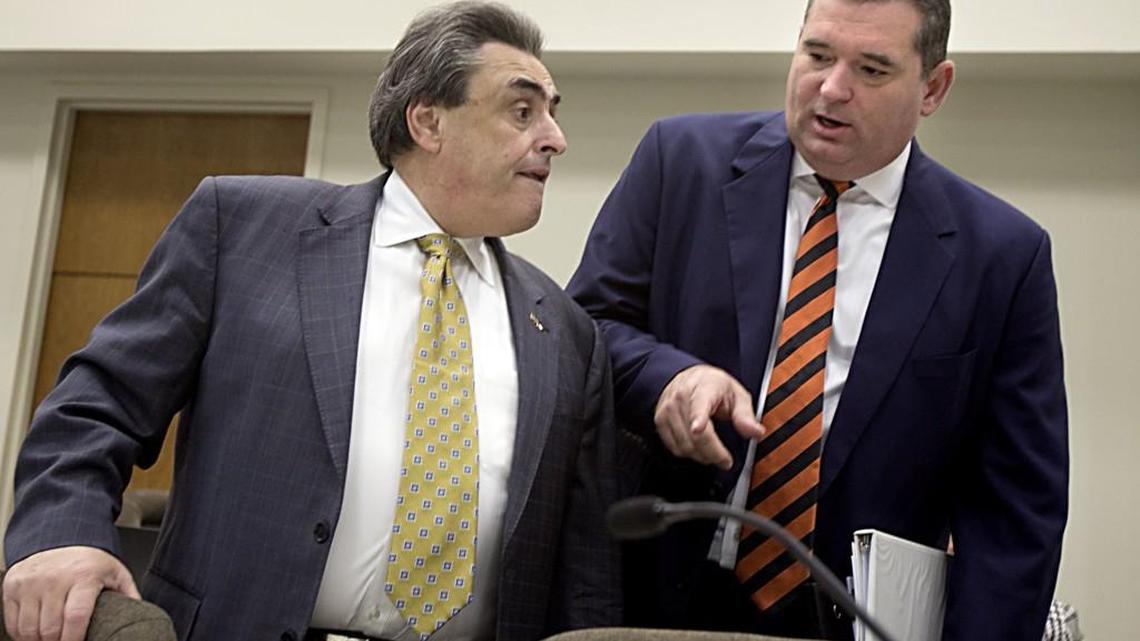 Co-chairs Senator Bob Rucho, left, and David R. Lewis, right, huddle before the start of the first day of the Joint Select Committee on Congressional Redistricting’s morning meeting at the N.C. Legislature on February 16. On Thursday, a panel of three federal judges said legislative maps drawn by Rucho and Lewis included unconstitutional racial gerrymandering.