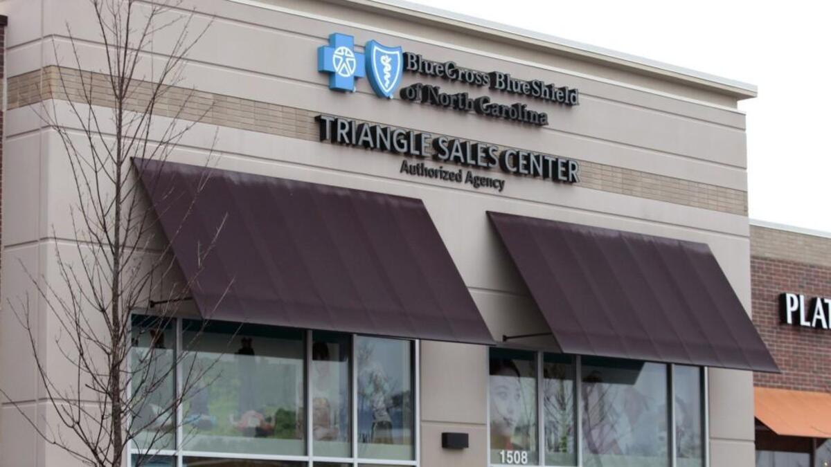 A client enters the Blue Cross Blue Shield of North Carolina Triangle Sales Center in the Village Market Place shopping center in Morrisville, NC Saturday, January 9, 2016.