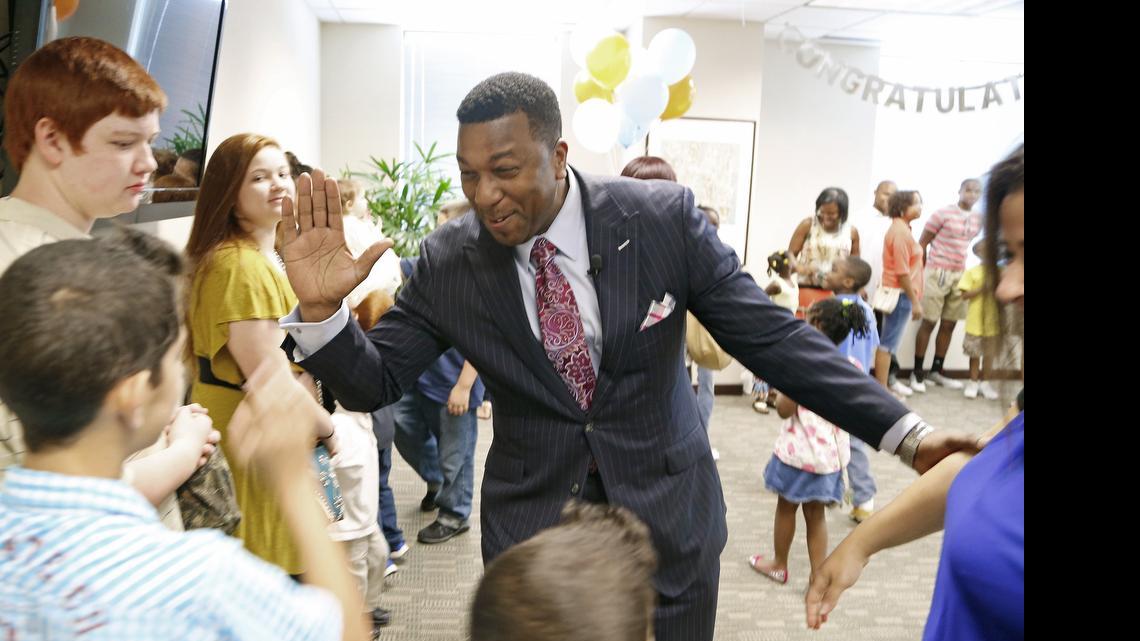 
Darrell Allison, center, president of Parents for Educational Freedom in North Carolina, greets families and supporters as they celebrate the news that they will be able to stay in private schools now that the N.C. Supreme Court has ruled that vouchers are constitutional. 
