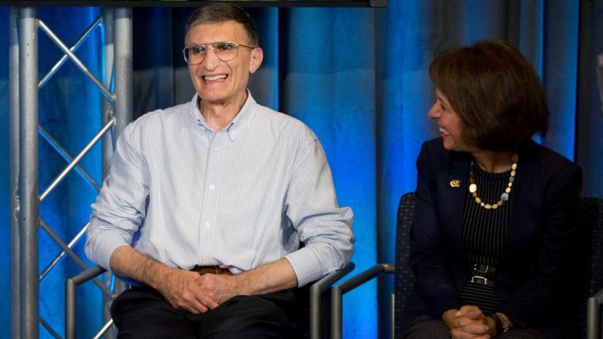 
UNC Chancellor Carol Folt listens as 2015 Nobel Prize for Chemistry recipient Aziz Sancar's answers questions during a press conference in the lobby of Marsico Hall Wednesday, October 7, 2015 in Chapel Hill, N.C. Sancar, the Sarah Graham Kenan Professor of Biochemistry and Biophysics at the UNC School of Medicine, along with Paul Modrich, a Howard Hughes Medical Institute investigator at Duke University and Tomas Lindahl of the Francis Crick Institute and Clare Hall Laboratory were awarded the 2015 Nobel Prize in Chemistry for mechanistic studies of DNA repair. 

