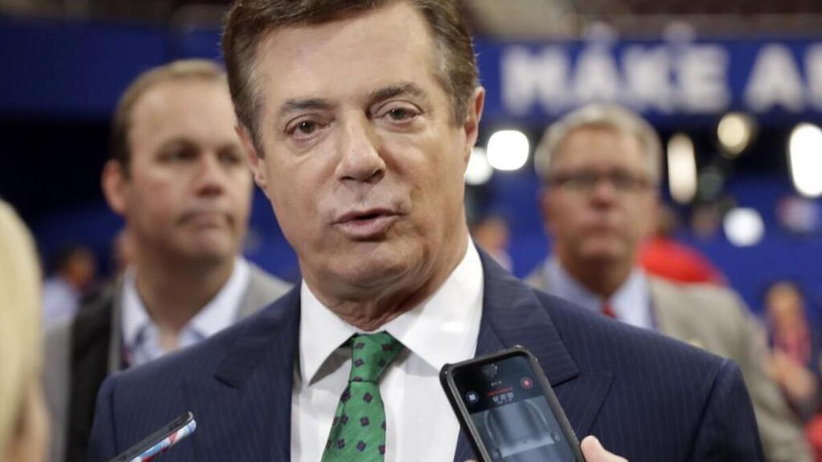 Trump campaign chairman Paul Manafort talks to reporters on the floor of the Republican National Convention at Quicken Loans Arena in Cleveland as Rick Gates listens at back left. President Donald Trump’s administration remains under scrutiny over potential ties between his associates and Russia in the run-up to the presidential election. Trump has denied knowing that any of his staff had communications with Russian officials during the campaign. But congressional probes are underway, and the FBI is investigating.