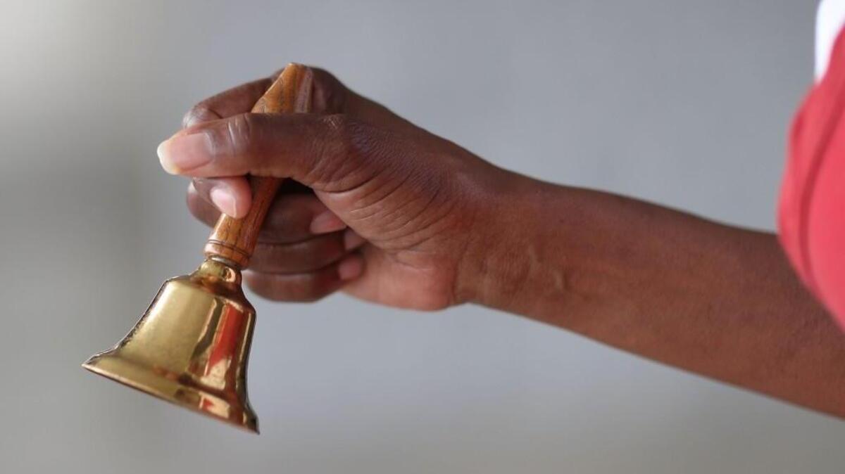 A bellringer for the Salvation Army greets people with a shaking of a bell as she collects donations in a red kettle on Giving Tuesday on November 28, 2017 in Hallandale, Florida. Giving Tuesday is a single day following the heavy Thanksgiving shopping period specifically focused on charity.